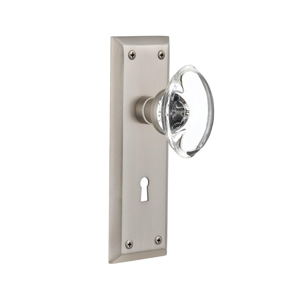 Nostalgic Warehouse NYKOCC Privacy Knob New York Plate with Oval Clear Crystal Knob with Keyhole in Satin Nickel